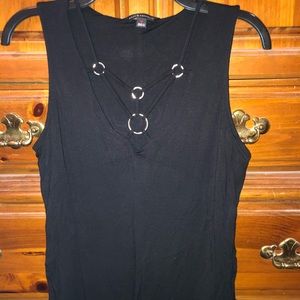 Sleeveless top, falls a bit below hip